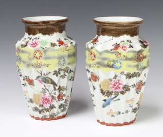 A pair of Japanese fluted vases decorated with birds amongst flowers 27cm 