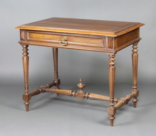 A 19th Century Continental rectangular walnut side/writing table fitted a frieze drawer and raised on turned and fluted supports with H framed stretcher 73cm x 90cm w x 61cm d 