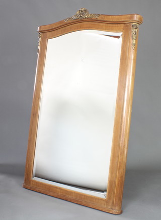 A 1920's French bevelled plate wall mirror contained in a mahogany arch shaped crossbanded frame with gilt metal mounts 156cm x 99cm 