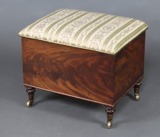 A 19th Century rectangular mahogany ottoman with upholstered hinged lid, raised on turned supports with brass caps and casters 44cm x 55cm x 42cm 