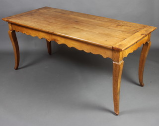 A 19th Century French fruitwood table raised on cabriole supports, fitted a frieze drawer and a pastry slide  74cm h x 186cm l x 77cm w 