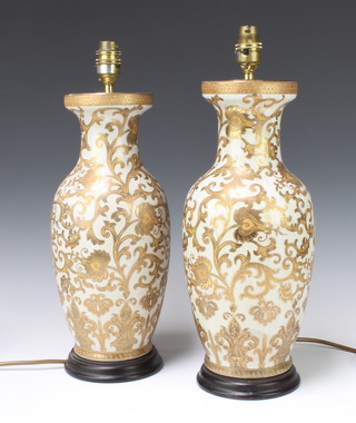 A pair of Oriental style club shaped table lamps in the form of urns with gilt decoration 38.5cm & 37cm