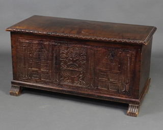 An 18th/19th Century Continental pine coffer with hinged lid and carved panel to the front 54cm h x 108cm w x 48cm d  