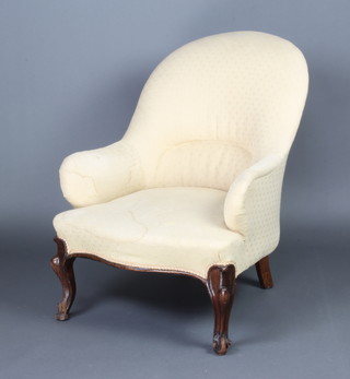 A Victorian metal framed tub back chair upholstered in light material raised on cabriole supports 