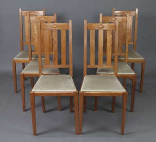 A set of 6 Art Nouveau carved light oak stick and bar back dining chairs raised on square tapered supports, the bases labelled Longhurst and Skinner, The Pantechnicon, Bedford 
