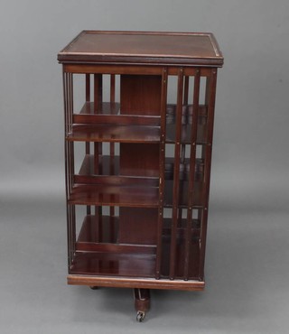 An Edwardian square mahogany 3 tier revolving bookcase 116cm h x 60cm w x 60cm d  