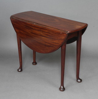 A Georgian oval mahogany drop flap tea table on club supports 71cm h x 91cm w x 36cm when closed x 97cm when open 