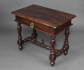 An 18th Century Continental walnut side table fitted 1 long drawer with H framed stretcher raised on bun feet 68cm h x 83cm w x 53cm d 