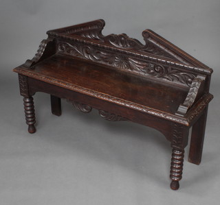 A Victorian carved oak window seat/hall bench with broken pediment, raised on bobbin turned supports 70cm h x 106cm w x 31cm d 