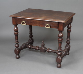 An 18th Century walnut side table of joined construction fitted 1 long drawer raised on turned supports with H framed stretcher and bun feet 76cm h x 88cm w x 59cm d 
