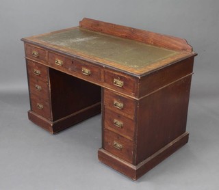 An Edwardian mahogany kneehole desk, the upper section with raised back inset a tooled leather writing surface above 1 long and 8 short drawers 76cm h x 123cm w x 66cm d 