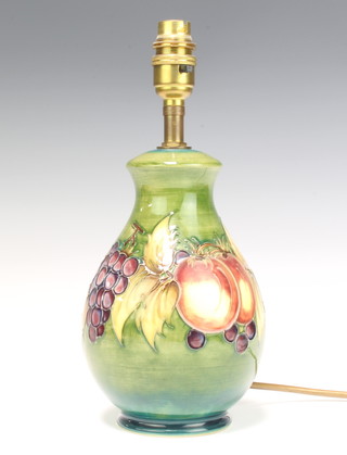 A modern Moorcroft baluster vase decorated the pomegranate design on a green ground  20cm 
