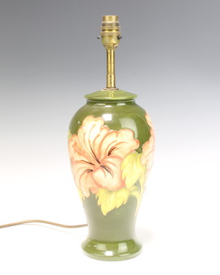 A Moorcroft style baluster table lamp decorated hibiscus on a green ground 28cm 