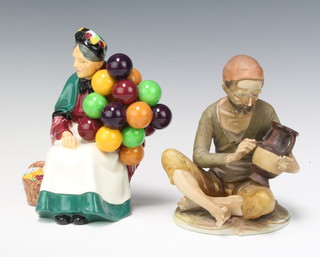 A Royal Doulton figure - The Old Balloon Seller HN1315 19cm and a Continental figure of a potter 17cm 