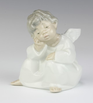 A Lladro figure of a seated angel 10cm 