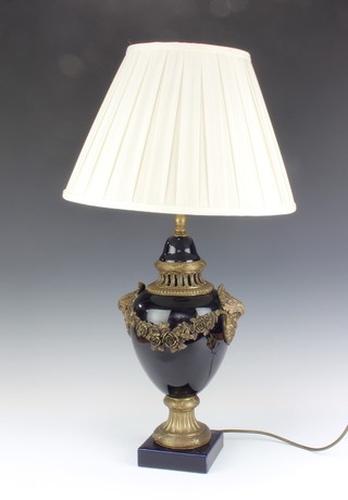 A Sevres style gilt metal mounted table lamp with mask handles 40cm