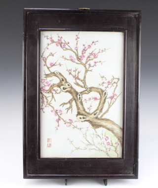 A Chinese Republic painted porcelain panel, The School of Tian Hexian, decorated with a blossoming prunus tree, bearing the seal mark of Tian Hexian 42cm x 27cm, contained in a hardwood frame (a similar subject see The Complete Collection of Porcelain of Jiangxi Province 1912-1949, published in 2008 page 59) . 