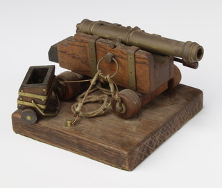 A model cannon with 11cm barrel raised on a wooden carriage and base 