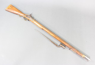 A British pattern F 1842 percussion musket with East India Company lock, the  99cm barrel complete with bayonet, the stock marked 1477