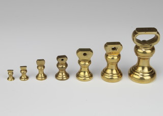 Seven graduated brass bell weights 1lb, 8 ozs, 4 ozs, 2 ozs, 1 ozs, 1/2 ozs and  1/4 ozs 