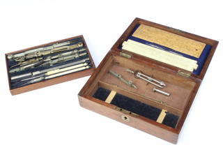 J Halden, a part geometry set contained in a wooden box comprising a Unique-Log slide rule and an Aston Mander Ltd gauge dated 1917