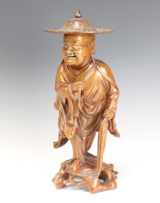 A Chinese carved hardstone figure of a standing sage with ivory set eyes and teeth 36cm h x 16cm 
