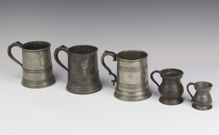 A 19th Century pewter pint tankard marked TV Doile Tower Inn Ripe, 1 other marked with a Crown XX, James Yates a pewter pint tankard (some corrosion and dents), a Quartern baluster measure and 1 other 