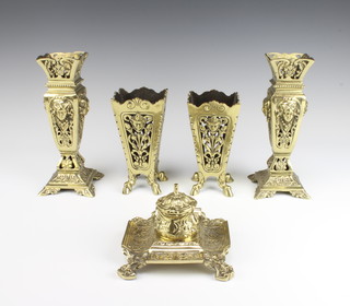 A square brass inkwell with hinged lid and associated liner 11cm x 14cm x 14cm, a  pair of Victorian pierced brass vases with mask decoration 22cm x 10cm x 10cm and 1 other pair 16cm x 9cm x 9cm 

