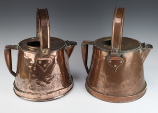 A pair of Victorian circular copper hot water carriers with swing handles 38cm x 38cm  and 38cm x 28cm 