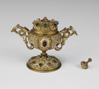 A 19th Century Continental gilt metal and "jewel encrusted" inkwell complete with glass liner 13cm h x 8cm diam. 