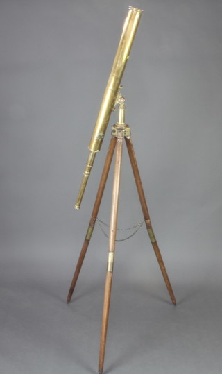 Broadhurst Clarkson and Co. of 63 Farringdon Road, London, a 19th Century brass 3 draw telescope raised on a turned oak tripod and with later side adjustment 