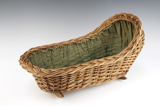 A child's basketwork rocking crib 30cm x 52cm x 26cm 


