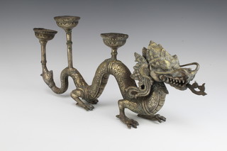 A Chinese gilt metal 3 light candelabrum in the form of a walking dragon 21cm x 56cm x 5cm 
