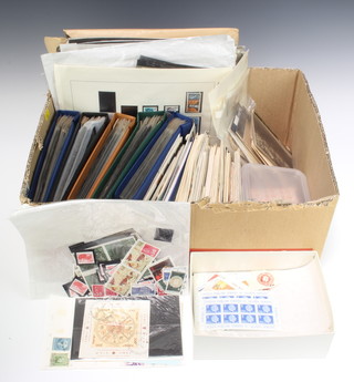 A collection of sheets of world stamps, 5 albums of first day covers, loose stamps, PHQ cards etc  
