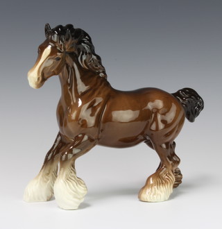 A Beswick figure of a cantering shire horse no.H975, brown gloss, by Arthur Gredington 22.2cm 
