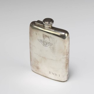 A silver hip flask of plain form engraved with the Bentley motorcar logo and monogrammed Birmingham 1915, 15cm, 258 grams 