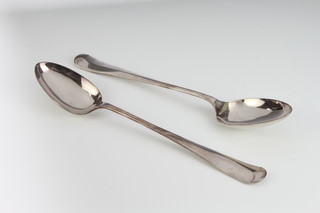 A pair of silver plated rat tail basting spoons and 6 glass table salts 
