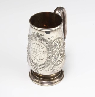 A Victorian repousse silver mug with presentation inscription Birmingham 1875, 268 grams 