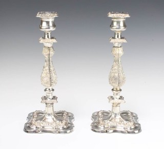 A pair of silver plated Georgian style candlesticks 30cm, a smaller pair 20cm 