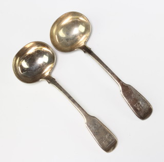 A pair of Victorian silver ladles with engraved crest London 1884, 134 grams