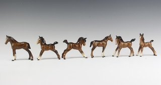 A Beswick figure foal, small thoroughbred type, facing right, 1817 by Arthur Greddington 8.3cm, a ditto foal small stretched upright 763 by Arthur Greddington brown gloss 8.9cm, ditto foal small stretched facing right 815 by Arthur Greddington 8.3cm, ditto foal small stretched facing left 997 brown gloss by Arthur Greddington 8.3cm, ditto foal smaller thoroughbred type facing left 1816 brown gloss by Arthur Greddington 8.9cm and a ditto small foal gambling left 996 brown gloss by Arthur Greddington 
