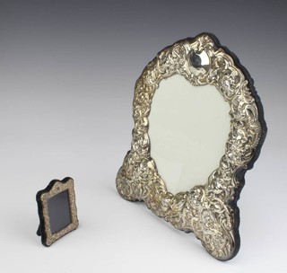 A Victorian style repousse silver heart shaped photograph frame 29cm, a ditto 9cm 