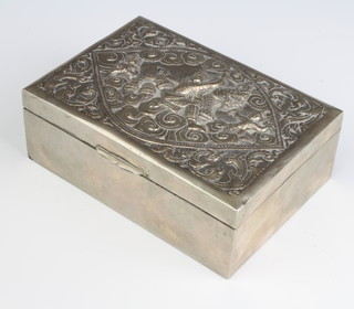 A rectangular repousse silver Indian cigarette box decorated with deities 14cm 