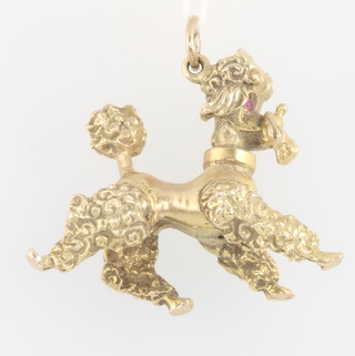 A 9ct yellow gold gem set poodle charm 13.9 grams