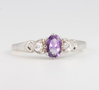 A 9ct white gold amethyst and paste dress ring size P 1/2
