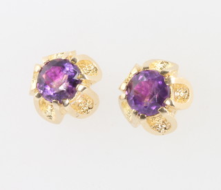 A pair of yellow gold amethyst ear studs 