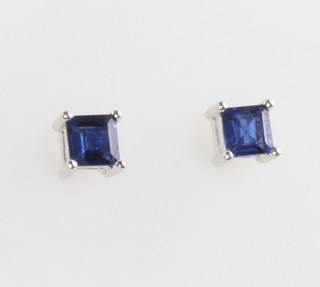 A pair of white gold square cut sapphire ear studs 4mm 