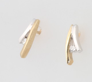 A pair of 9ct yellow gold diamond set ear studs 11mm
