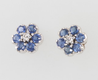 A pair of 18ct white gold sapphire and diamond daisy ear studs 8mm 