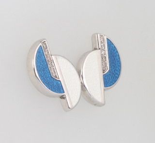 A pair of silver enamelled and diamond ear studs 15mm 